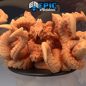 May include: A 3D printed miniature of a multi-armed, tentacled creature with a gaping maw. The creature is a light orange color and has a textured surface. The miniature is on a black base.