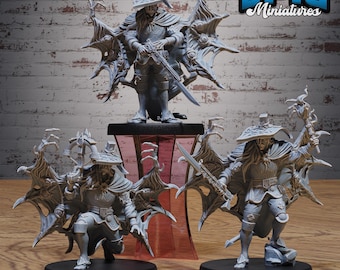 May include: Three grey unpainted miniature figures of hunters wearing wide-brimmed hats and capes with wing-like structures. Each figure holds a long weapon, with one kneeling and two standing, all mounted on circular black bases.