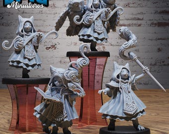 May include: A collection of gray miniature figurines, including cat-like characters in robes and owl companions. The figurines are on black bases and set against a wooden surface. The text "EPIC Miniatures" is visible in the top left corner.