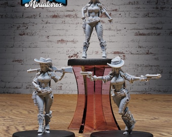 May include: Three gray plastic miniature figures of women wearing cowboy hats and holding guns. The figures are posed in different action stances. The figures are on a wooden surface with a red plastic stand in the background. The text "EPIC Miniatures" is visible in the top left corner of the image.
