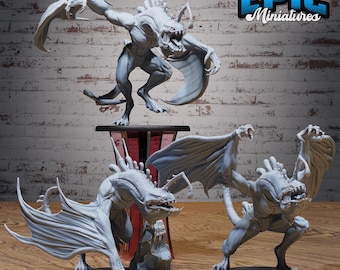 May include: A collection of gray miniature fantasy creatures with bat-like wings and sharp teeth. One figure is perched on a stand, while two others stand on circular bases. The Epic Miniatures logo is visible in the upper right corner.