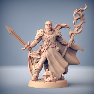 May include: A detailed miniature figurine of a male wizard with a flowing robe, holding a sword and a staff with a swirling flame design. The wizard is wearing leather armor and has a determined expression on his face.