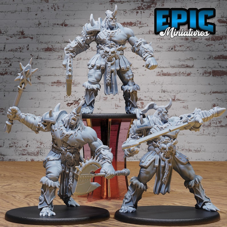May include: Three gray, unpainted miniature figures of horned warriors with weapons. The figures are posed in dynamic stances and are ready for battle.  The figures are from the Epic Miniatures line.
