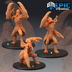 May include: Three unpainted miniature figures of a crab-like creature with a humanoid torso and multiple tentacles. The figures are posed in different stances, with one standing upright, one crouching, and one standing with its claws raised. The figures are labeled A, B, and C.