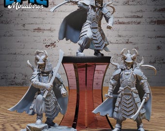 May include: Three gray miniature samurai figures with swords and armor are displayed. One figure stands on a pedestal, while the other two are on circular bases. The figures are detailed and have helmets and capes. The logo "EPIC Miniatures" is in the top left corner.