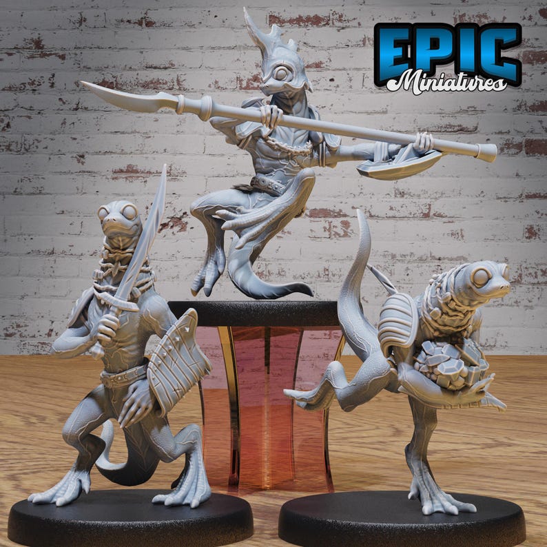 May include: Three gray painted miniature figurines of lizard-like creatures with humanoid features. The figures are posed in a dynamic fashion, with one holding a spear, another holding a sword, and the third holding a rock. The figures are standing on black bases. The figures are labeled "EPIC Miniatures".