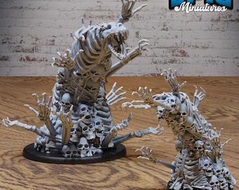 May include: Two skeletal figures made of bones and skulls, one larger than the other, with outstretched arms and hands. The larger figure has a skull head with a gaping jaw. Both figures are standing on black circular bases.  EPIC Miniatures.