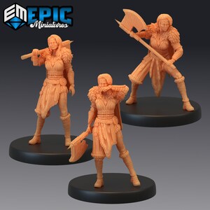 May include: Three unpainted plastic miniatures of female figures with axes. Each figure is wearing a leather skirt, fur-lined armour, and boots. The figures are posed in different stances, with one holding an axe in each hand, one holding an axe in her right hand, and one holding an axe in her left hand.