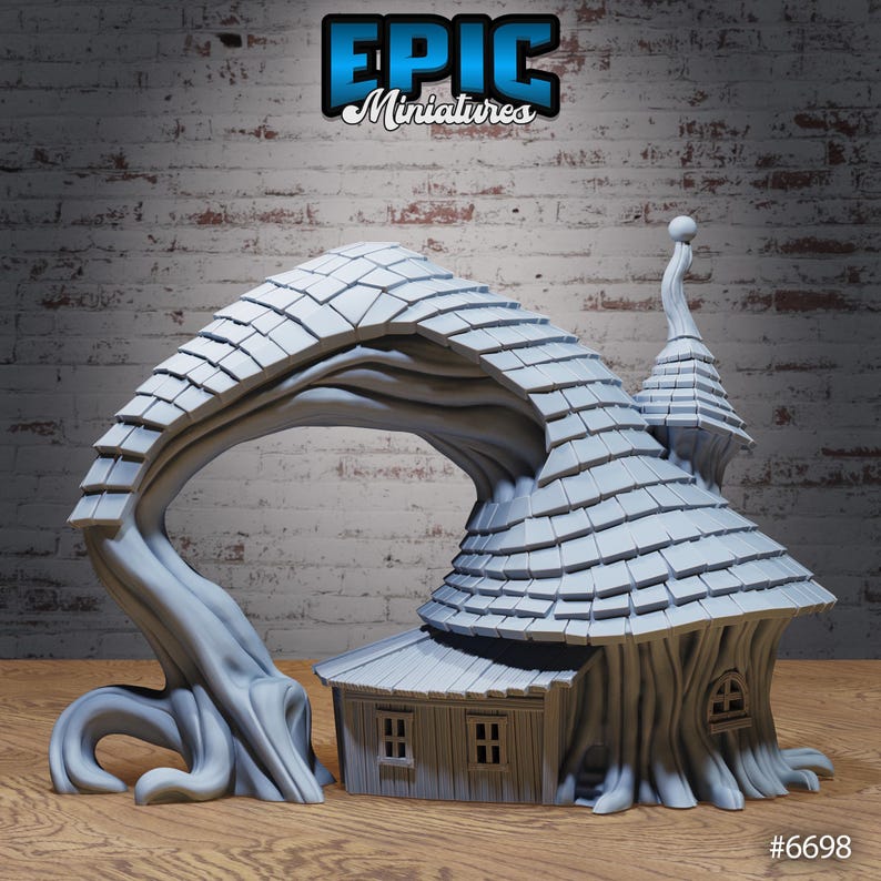 May include: A gray miniature fantasy house with a tree archway. The house has a shingled roof, two small windows, and a tree trunk base. The text "EPIC Miniatures" is at the top. The number "#6698" is at the bottom.