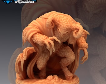 May include: A detailed miniature figurine of a horned, furry creature with large, owl-like eyes. The creature is wearing a flowing robe and has a menacing expression. The figurine is painted in a light brown color and is set on a round base.