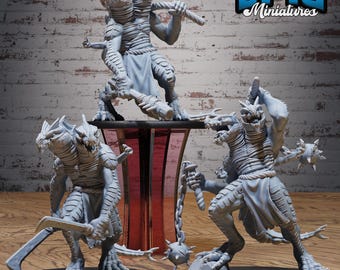 May include: A collection of grey miniature fantasy figures. The figures are reptilian humanoids with multiple heads and are posed with weapons such as swords, maces, and clubs. The figures are on black bases. The text "EPIC Miniatures" is in the upper right corner.