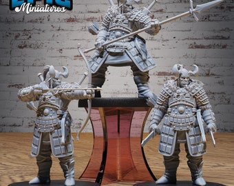 May include: Three grey plastic miniatures of warriors wearing armor and holding weapons. The miniatures are on black bases and are posed in different fighting stances. The miniatures are from the company EPIC Miniatures.