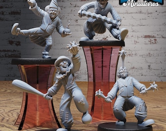 May include: Four grey painted miniature figurines of clowns with different weapons and poses. The figurines are on black bases and are displayed on red stands. The text "EPIC Miniatures" is in the upper right corner of the image.