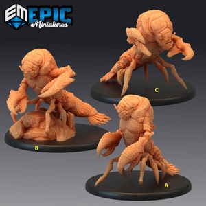 May include: Three 3D printed miniature figures of a crab-like creature with a humanoid torso and multiple legs. The figures are painted in a light orange color and are posed in different positions. The figures are labeled A, B, and C.