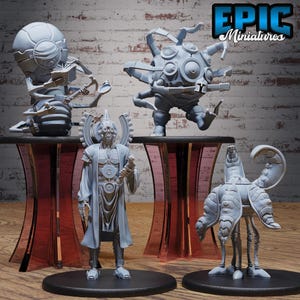 May include: A collection of gray miniature figurines, including a robot-like figure reading a book, a spiky orb-shaped creature, a humanoid with a staff, and a tentacled being. The figurines are displayed on a table with a red-tinted glass base. The logo "EPIC Miniatures" is visible.