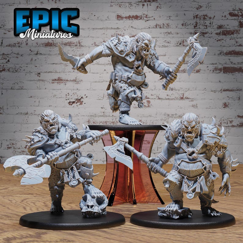 May include: Three unpainted miniature figures of orcs, each holding a weapon. The orcs are wearing armor and have fierce expressions. The miniatures are made of a gray plastic material.
