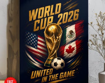 May include: A rectangular wall art print featuring a gold trophy and a soccer ball centered between the flags of the United States, Mexico, and Canada. The text reads WORLD CUP 2026 and UNITED IN THE GAME in bold gold lettering on a dark background.