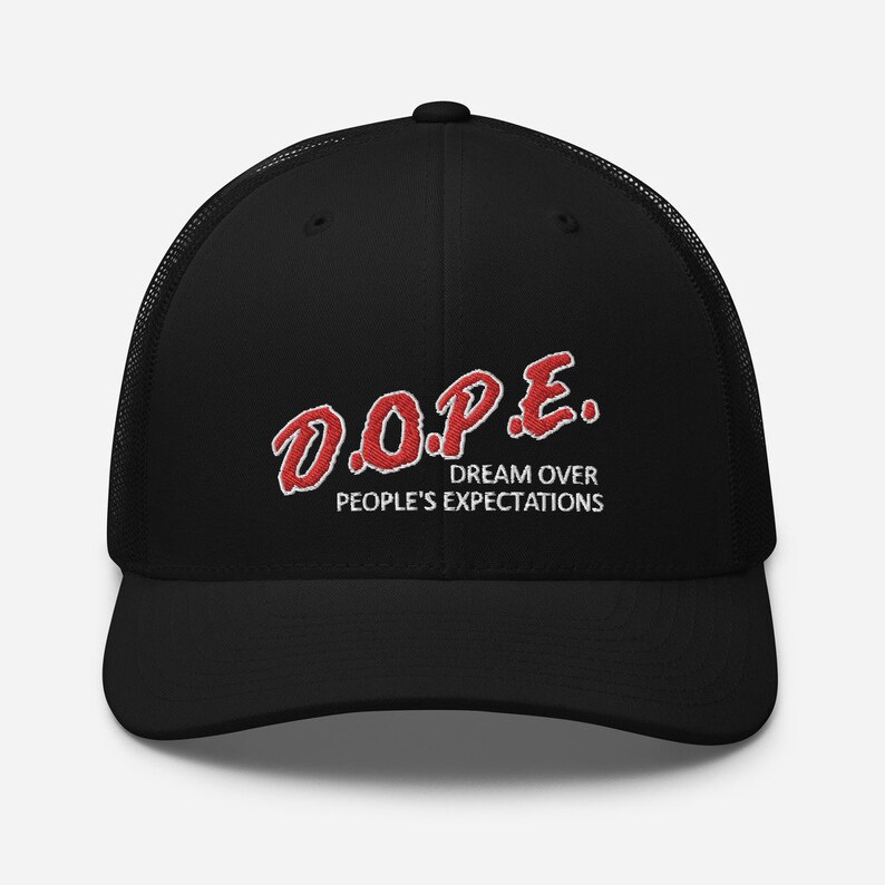 May include: Black trucker hat with a red embroidered logo that says "D.O.P.E. DREAM OVER PEOPLE'S EXPECTATIONS"