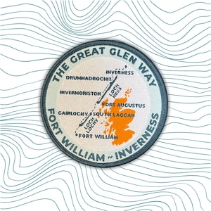 May include: A circular patch with the text "THE GREAT GLEN WAY" and "FORT WILLIAM ~ INVERNESS" in a dark teal font. The patch features a map of the Scottish Highlands with key locations labeled in black.