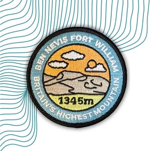 May include: A blue and yellow embroidered patch with the text "Ben Nevis Fort William Britain's Highest Mountain 1345m". The patch features a stylised mountain range with a sun and clouds.