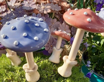 Mushroom - Small and large ceramic mushrooms on solid metal rod