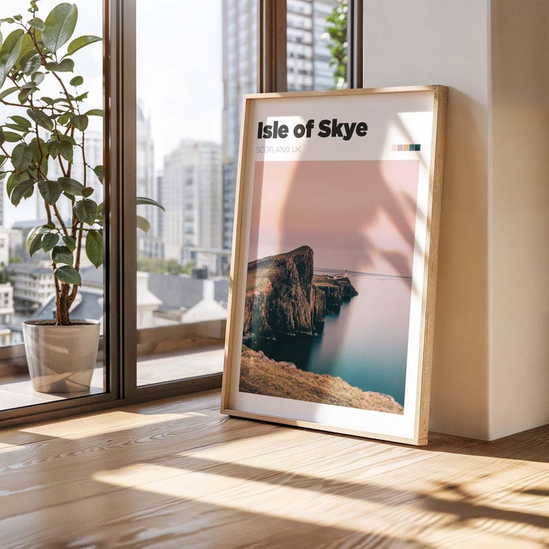 May include: A framed print of a landscape photograph with a rocky cliff overlooking a body of water. The print has the text "Isle of Skye, Scotland, UK" at the top.