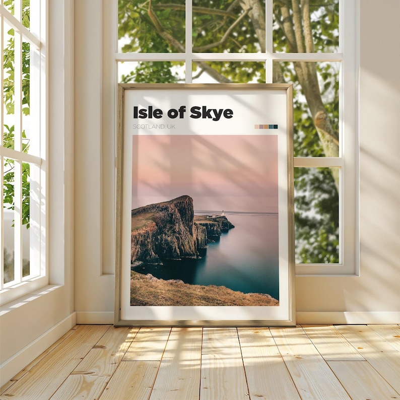 May include: A poster with a minimalist design featuring a photograph of a rocky cliff overlooking a body of water. The poster has the text "Isle of Skye" in bold black letters and "Scotland, UK" in smaller black letters.