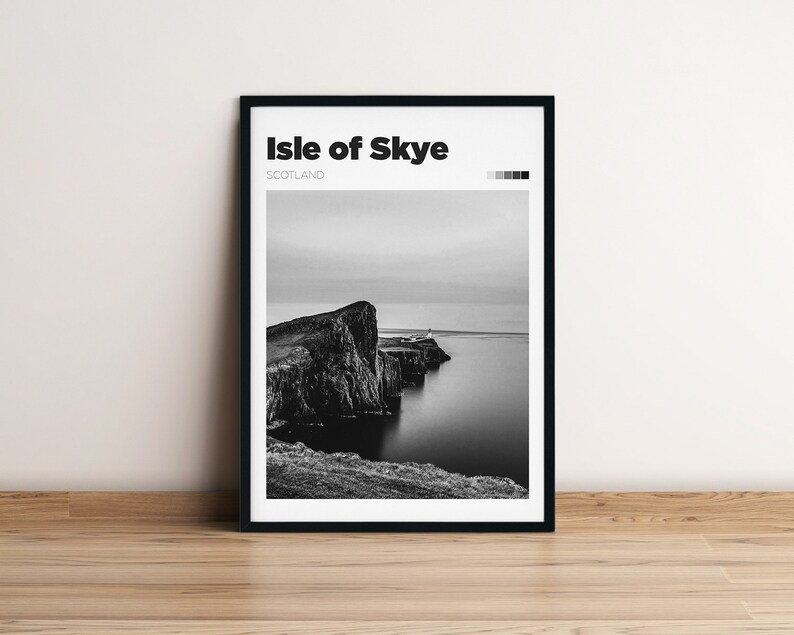 May include: Black and white photograph of a rocky cliff on the Isle of Skye, Scotland. The cliff is surrounded by water and there is a small building on top of the cliff.
