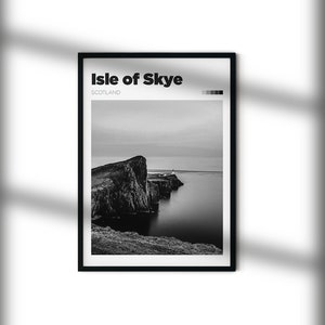 May include: A black and white photograph of a rocky cliff on the Isle of Skye, Scotland. The cliff is surrounded by water and the sky is cloudy.