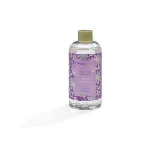 May include: A clear glass bottle of Lilac & Lavender fragrance oil diffuser refill by Hassett Green London. The bottle has a purple and gold floral design with the text "Fragrance Oil Diffuser Refill Lilac & Lavender 250ml e 8.45 US fl.oz."