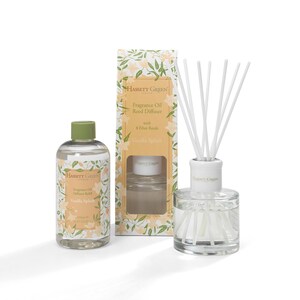 May include: A Hassett Green fragrance oil diffuser set, including a refill bottle and a box. The set features a glass diffuser bottle with white reeds, a refill bottle, and a box with a floral design. The products are labelled "Vanilla Splash".