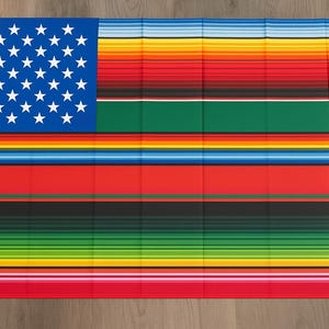May include: A rectangular flag featuring the American flag design on the upper left corner, with a blue field and white stars. The rest of the flag has horizontal stripes in various colors, including red, green, yellow, and black.