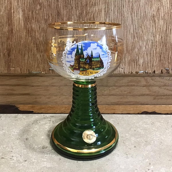 Vintage German Wine Glass Gold Rim with Ribbed Green Stem, Grapes Pattern around the Glass with a  Image City on the Front.