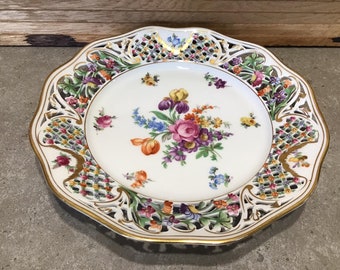 Vintage Dresden Schumann 9.3 inch reticulated Hand Painted Floral Plate Border is pierced and painted with flowers and gold gilt accents.