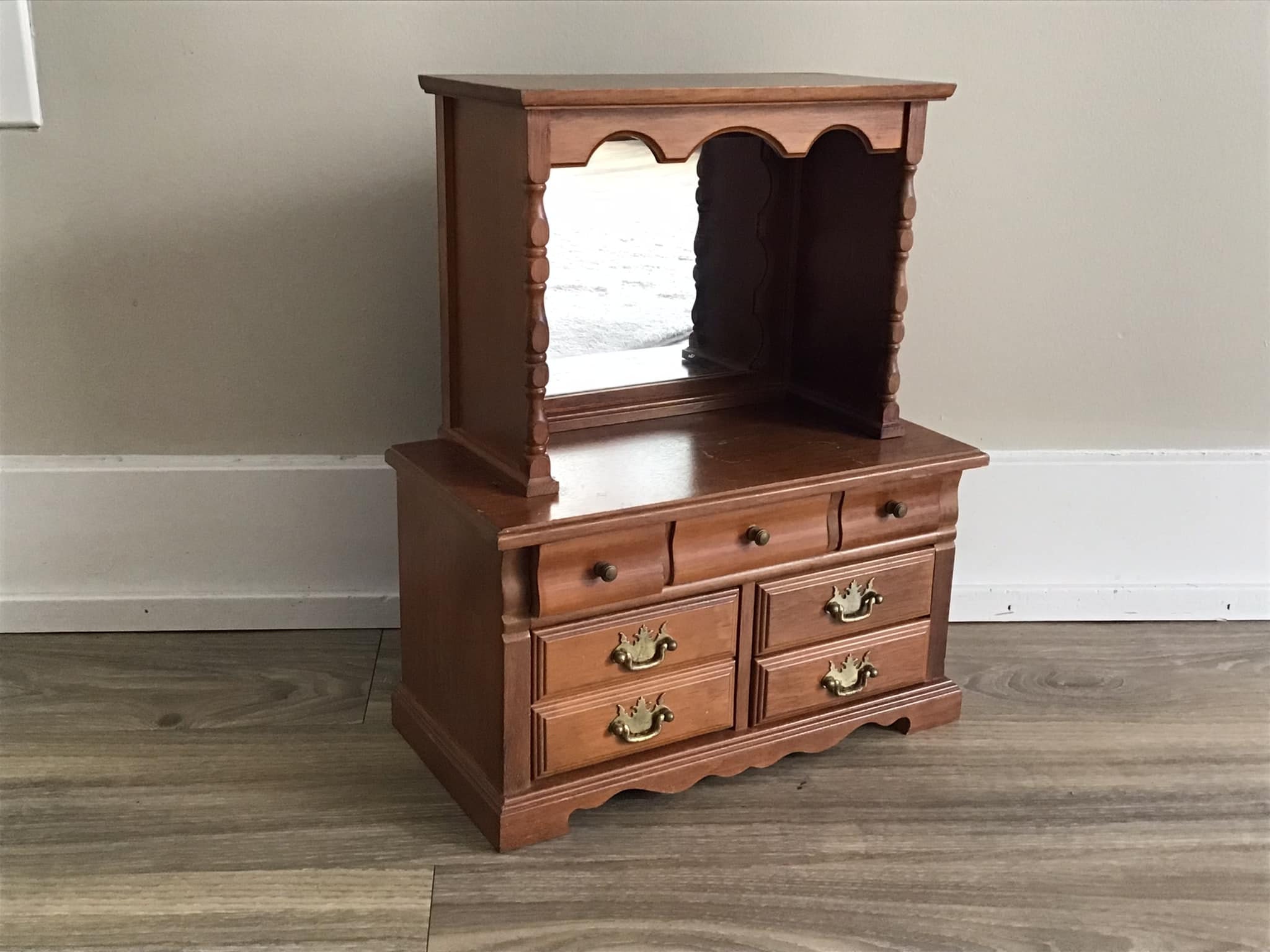 Dresser with outlet mirror and shelves