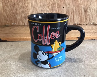 Taza coleccionable de Mickey Mouse de Disney, color negro y azul