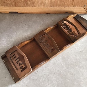 May include: Wooden wall-mounted organizer with three compartments, each labeled with the words "Mail", "Bills", and "Misc."