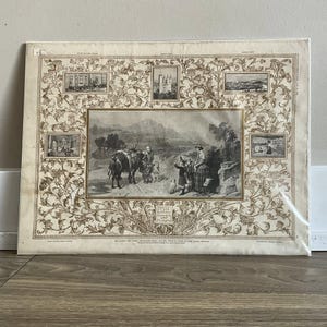 Peut inclure: Estampe ancienne présentant un paysage central avec des personnages et des animaux, encadré de petites images et de motifs floraux. L'estampe, dans des tons bruns et beiges, a un style historique détaillé.