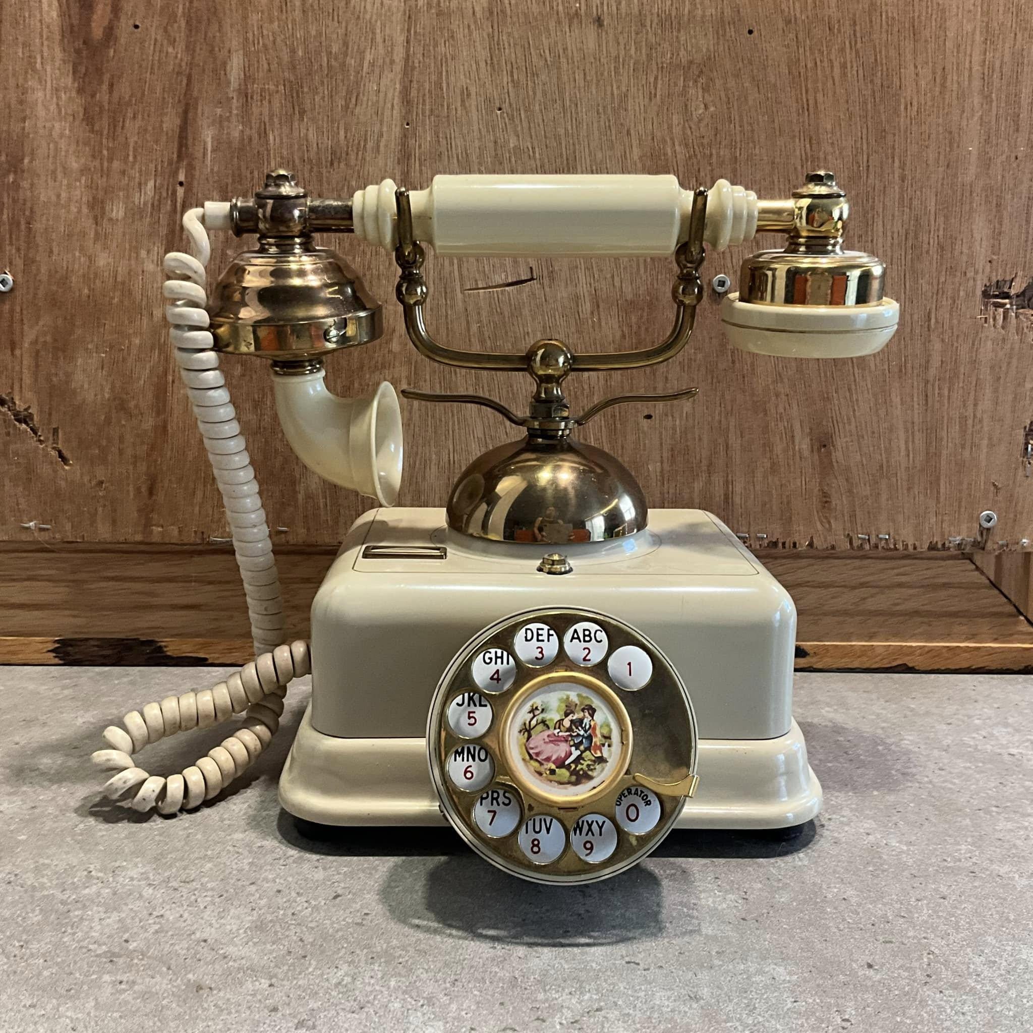 Vintage Rotary Dial Telephone With Romantic Image of a Couple on