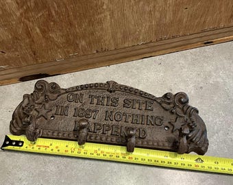 Funny Cast Iron Hook Rack: 'On This Site In 1897 Nothing Happened' - Novelty Coat & Towel Hanger
