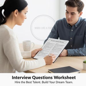 May include: Two people are seated at a wooden table, reviewing an "Interview Questions Worksheet" in a black clipboard. A mug, a small plant, and a closed notebook are also on the table. The text at the bottom reads "Interview Questions Worksheet".