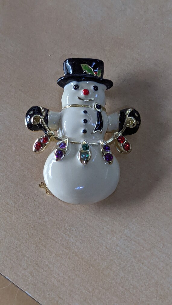 Snowman Holding Christmas Lights Brooch