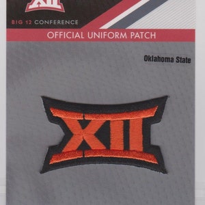 May include: Official Oklahoma State Big 12 Conference uniform patch. The patch features a black and orange design with the Roman numeral XII. The patch is on a gray background with text that reads "Official Uniform Patch."