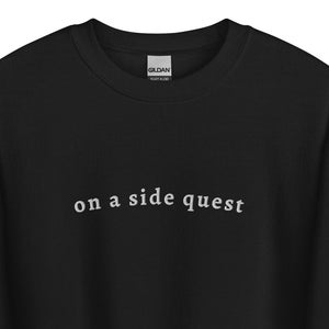 May include: Black sweatshirt with the text "on a side quest" in white lettering.