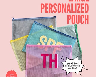 May include: Five large mesh zippered pouches in different colors, including pink, yellow, green, blue, and gray. The pouches are stacked on top of each other. The pink pouch has the word "THIS" written in large pink letters. The text "great for bachelorette parties!" is written in a speech bubble.