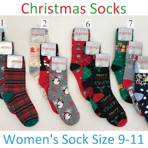 May include: Assortment of 12 Christmas themed socks in various colors and patterns, including red, green, white, blue, and gray. The socks feature designs such as reindeer, penguins, snowflakes, candy canes, and Christmas trees. The socks are labeled with the number 1, 2, 6, and 7. The socks are for women's size 9-11.