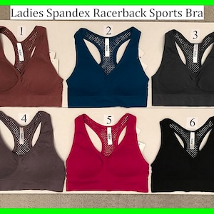 May include: Six racerback sports bras in different colors: brown, blue, gray, charcoal, pink, and black. Each bra has a mesh panel in the back.