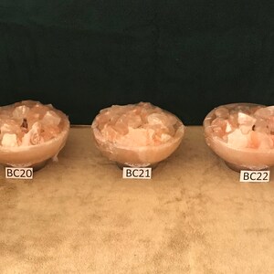 May include: Three pink Himalayan salt lamps in bowls, labelled BC20, BC21, and BC22.