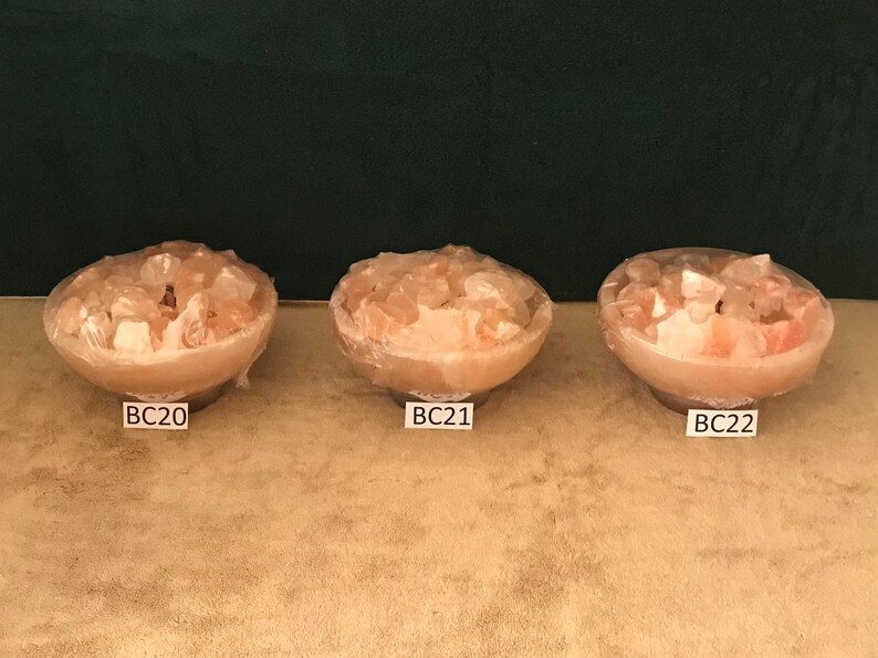 May include: Three pink Himalayan salt lamps in bowls, labelled BC20, BC21, and BC22.