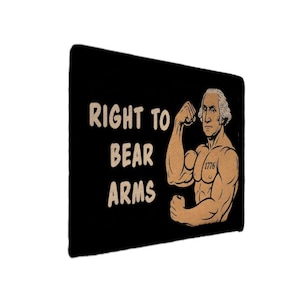 May include: Black rectangular patch with the text "RIGHT TO BEAR ARMS" in tan letters. An illustration of a muscular George Washington flexing his bicep is on the right side of the patch. The year "1776" is printed on his torso.
